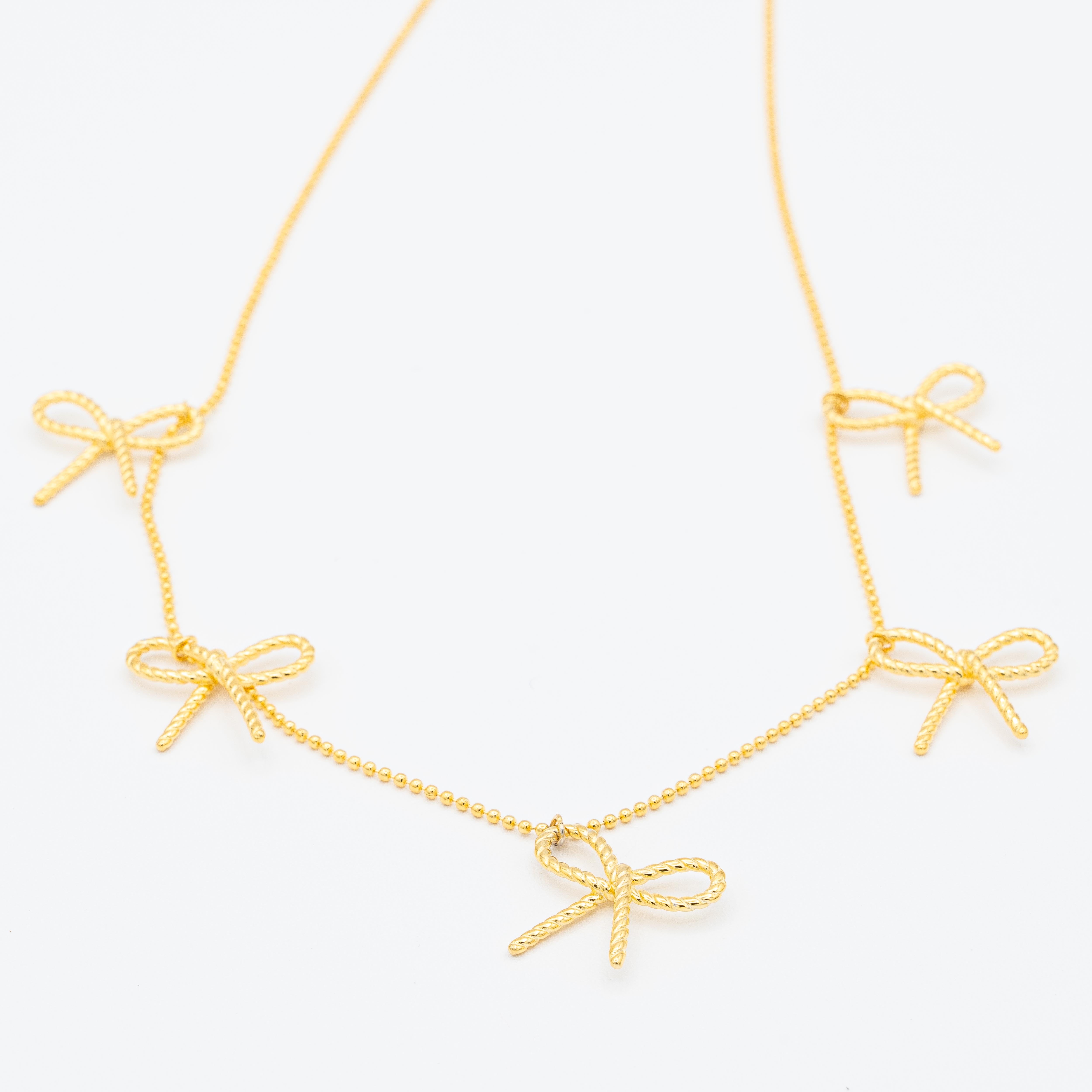 Emma Rope Bow Multi Charm Necklace