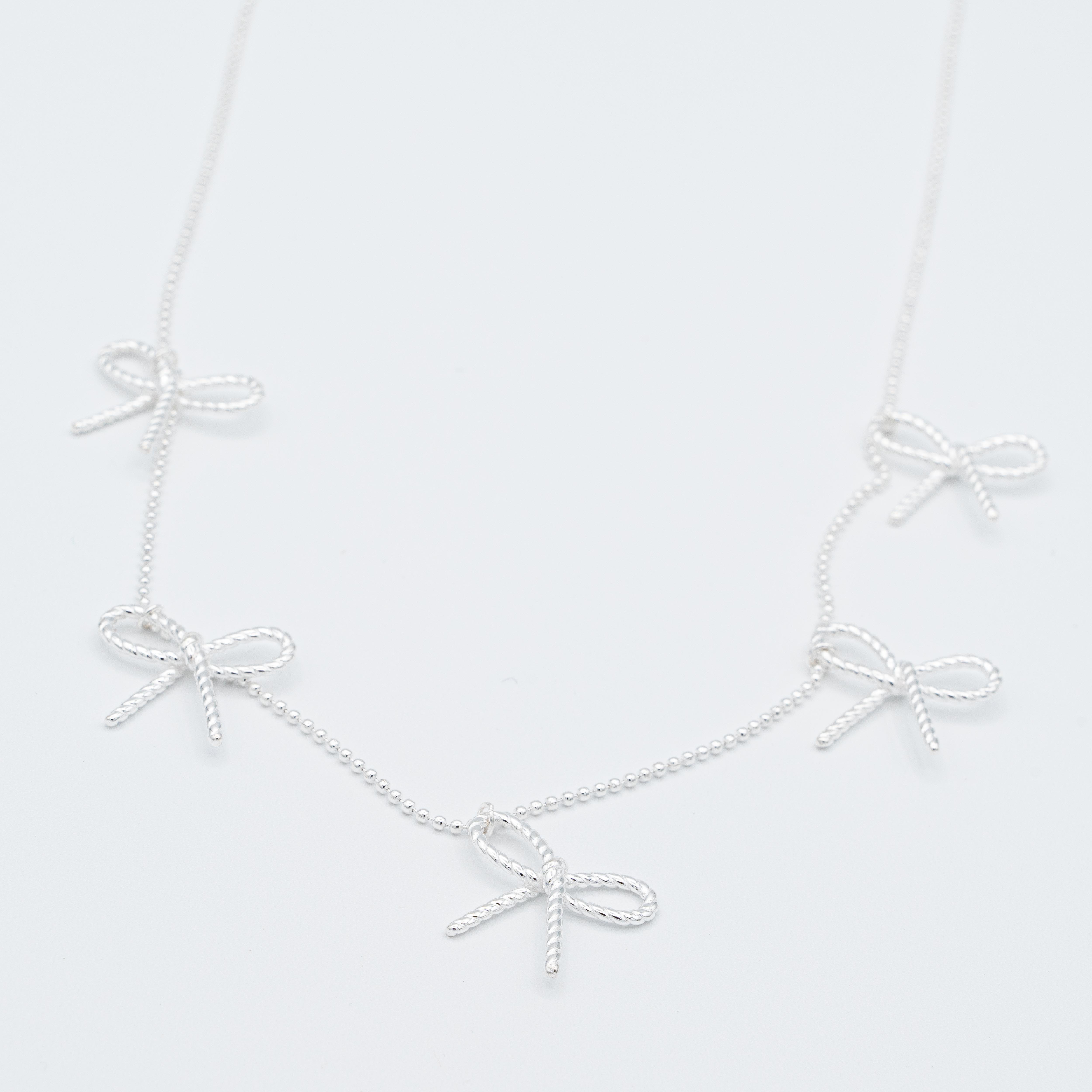Emma Rope Bow Multi Charm Necklace